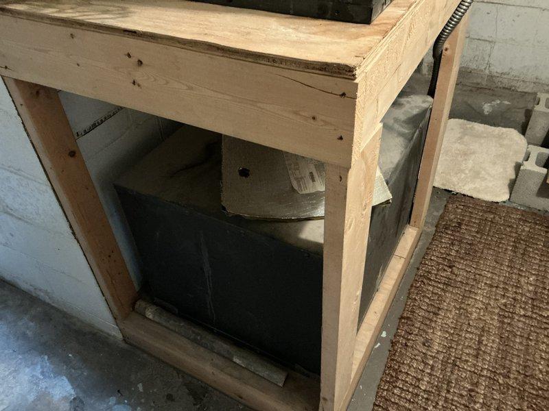 Conducted comprehensive on-site estimate for geothermal HVAC system installation. Evaluated existing mechanical room space containing QT-EA unit with multiple refrigerant lines and documented current equipment configuration, including connection points and spatial constraints. Assessed basement utility area with wooden framework structure to determine feasibility and requirements for geothermal heat pump system integration with existing infrastructure.