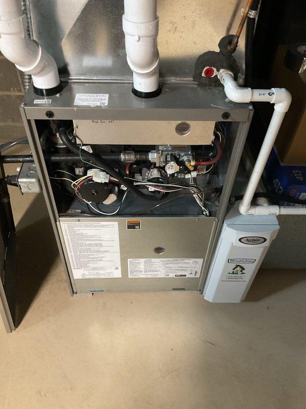 Performed comprehensive air conditioning tune-up on 4-year-old residential HVAC system. Conducted visual inspection of gas furnace interior components, verified proper operation of control mechanisms, gas valves, and electrical connections, and inspected exterior condensing unit. All system components found operating within normal parameters with no immediate service needs identified.