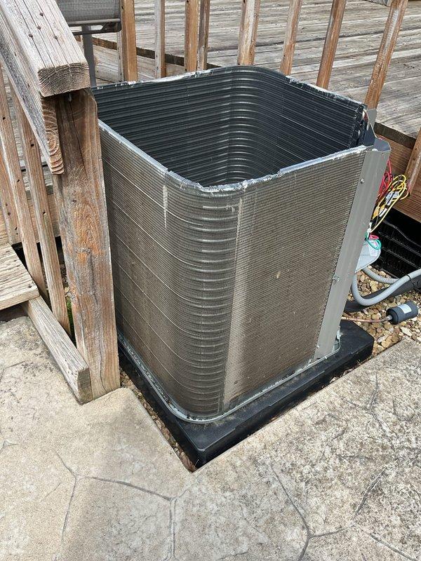 Completed MVP cooling maintenance visit on a one-year-old system. Inspected and photographed indoor air filter, which showed clean condition with proper airflow through pleated media, and verified outdoor condenser unit operation with refrigerant lines intact and properly routed. Unit operating within normal parameters with adequate clearance and no issues identified.