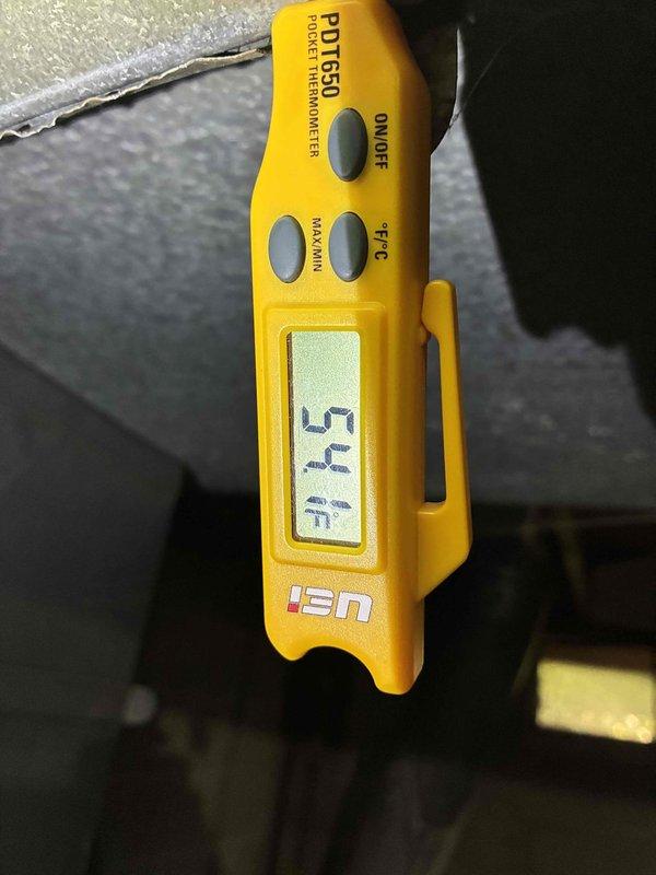 Completed annual AC tune-up on 3-year-old system. Measured supply air temperature at 54°F and inspected blower wheel assembly, noting dust accumulation on squirrel-cage blades but confirming functional operation. System operating within normal parameters.
