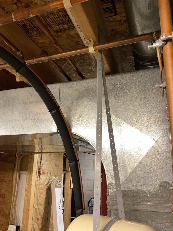 Completed installation of a 40-gallon tall Bradford White tanked water heater in basement utility area. Removed existing unit and installed new water heater with proper venting through metallic exhaust vent pipe, connected copper supply and distribution lines, and verified all plumbing connections were secure and leak-free. Unit was tested for proper operation and all safety systems confirmed functional.