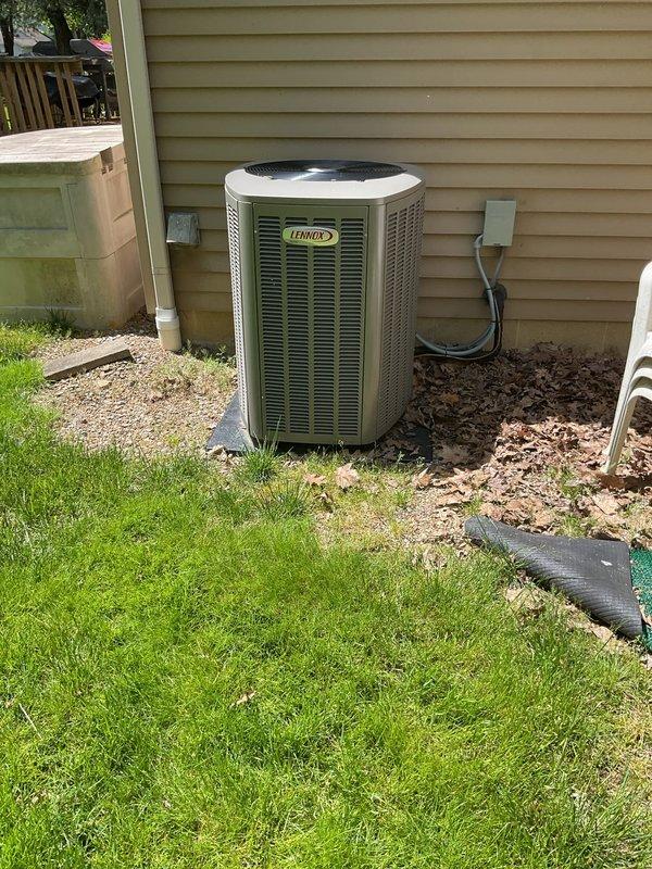Completed routine cooling maintenance on residential Lennox air conditioning system. Performed standard inspection procedures, verified proper system operation, and documented equipment condition with photos showing outdoor condensing unit and associated electrical components. System confirmed operational with no deficiencies noted at time of service.
