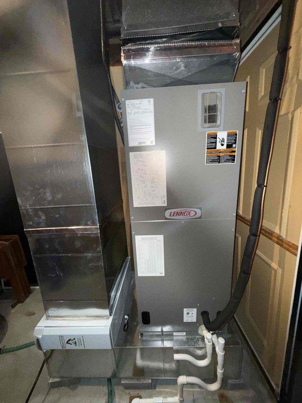 Completed routine maintenance visit on a one-year-old heat pump system with Lennox air handler. Inspected blower wheel assembly and noted moderate dust accumulation on blades and housing. Verified air handler operation, checked all connections including PVC condensate drain lines at base of unit, and confirmed system specifications matched manufacturer requirements.