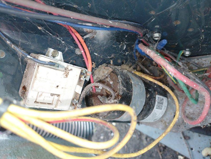 # HVAC Maintenance - Cooling

Completed preventive maintenance on 14-year-old air conditioning system. Upon inspection, found significant dust accumulation, cobwebs, and debris throughout electrical compartment and capacitor housing. Electrical connections showed signs of aging with minor wire insulation deterioration and disorganized wiring routing. White deposits and potential corrosion observed on terminal blocks and brass fittings. Cleaned all electrical components, removed debris from compartment, and inspected capacitor functionality. Verified all wire connections were secure at terminal points. System tested and confirmed operational following maintenance procedures.