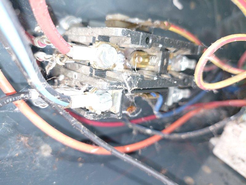 # HVAC Maintenance - Cooling

Completed preventive maintenance on 14-year-old air conditioning system. Upon inspection, found significant dust accumulation, cobwebs, and debris throughout electrical compartment and capacitor housing. Electrical connections showed signs of aging with minor wire insulation deterioration and disorganized wiring routing. White deposits and potential corrosion observed on terminal blocks and brass fittings. Cleaned all electrical components, removed debris from compartment, and inspected capacitor functionality. Verified all wire connections were secure at terminal points. System tested and confirmed operational following maintenance procedures.
