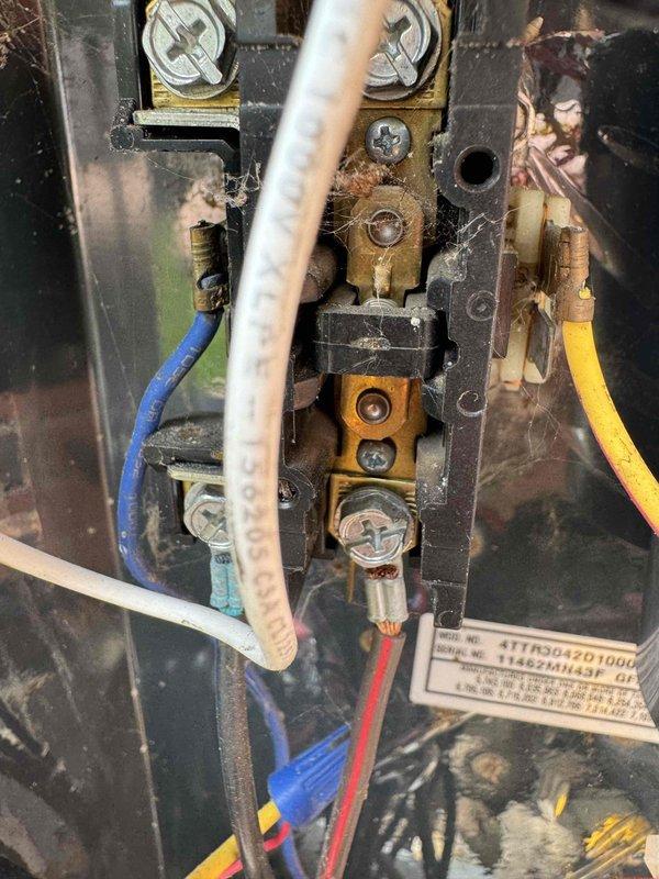 Completed MVP cooling maintenance visit on 14-year-old system. Performed electrical inspection of control panel, finding significant dust, debris, and cobweb accumulation throughout terminal connections and enclosure. Verified voltage readings at 207V using digital multimeter and confirmed all wire connections remain secure despite age-related oxidation on brass terminals and environmental exposure to components.