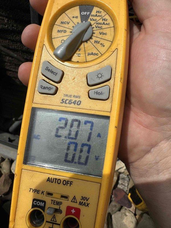 Completed MVP cooling maintenance visit on 14-year-old system. Performed electrical inspection of control panel, finding significant dust, debris, and cobweb accumulation throughout terminal connections and enclosure. Verified voltage readings at 207V using digital multimeter and confirmed all wire connections remain secure despite age-related oxidation on brass terminals and environmental exposure to components.