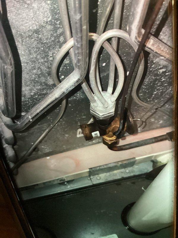 Completed MVP cooling maintenance visit as scheduled. Inspected and tested electrical components including fuse holder assembly with Ferraz Shawmut time-delay fuses, verified proper amperage ratings and connections. Examined refrigerant line set, U-bend configuration, and brass fittings for leaks and proper insulation integrity within the unit cabinet.