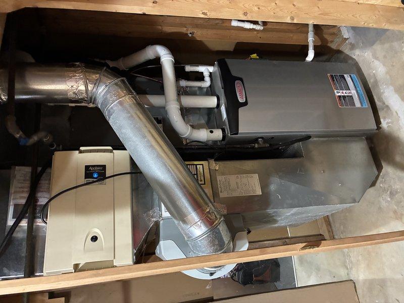 Completed preventive maintenance visit on a 5-year-old residential air conditioning system for MVP customer. Performed thorough inspection of air handler unit and evaporator coil assembly, documenting equipment condition with photos. System components were found to be in acceptable operating condition with normal dust accumulation on heat exchanger fins.