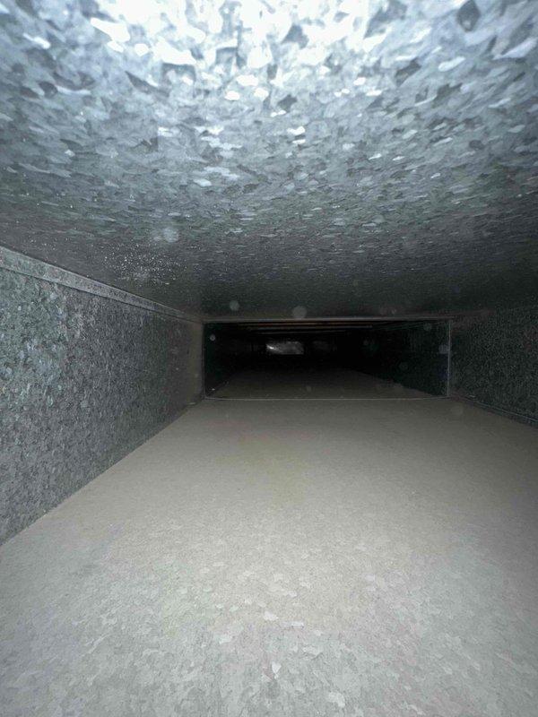 Completed comprehensive duct cleaning service for residential HVAC system with approximately 14-15 supply and return vents. Removed accumulated debris, dust, leaves, and organic matter from ductwork interior using professional vacuum equipment and agitation tools. Interior duct surfaces showed typical buildup consistent with normal system operation, including dust accumulation on walls and debris collection at register boots. All accessible ductwork sections were thoroughly cleaned to restore proper airflow and improve indoor air quality.