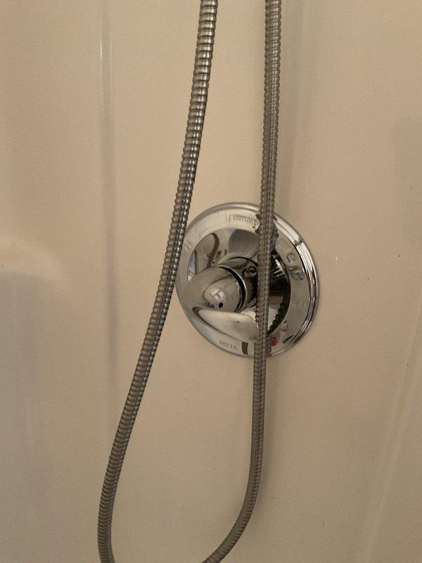 Replaced defective shower cartridge in master bathroom after sawing off damaged handle that prevented standard removal. Installed new trim kit upon completion of cartridge replacement to restore full functionality and appearance of the shower valve assembly.