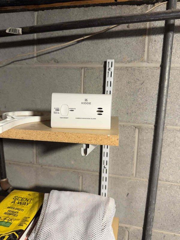 Installed new 80% efficiency Lennox furnace in basement utility area as first-stage heating system replacement. Connected unit to existing ductwork system with vertical supply plenum and horizontal distribution runs, installed carbon monoxide alarm in mechanical room per safety code requirements, and verified proper clearances and operational functionality of complete system.