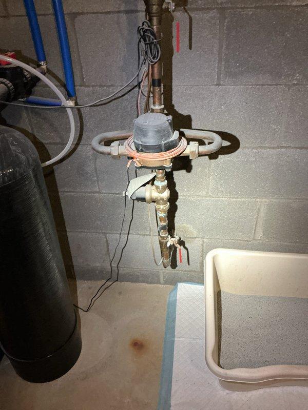 Responded to service call for leaking water tank in 27-year-old residential property. Upon inspection, identified leak originating from pressure tank assembly and associated brass fittings in basement utility area. The existing expansion tank, which had been in service for approximately eight years, showed signs of failure at connection points. Evaluated pressure gauge readings and tested system integrity. Addressed leak source, inspected copper piping and PEX water line connections, and verified proper drainage catchment was in place beneath plumbing assembly to prevent water damage.