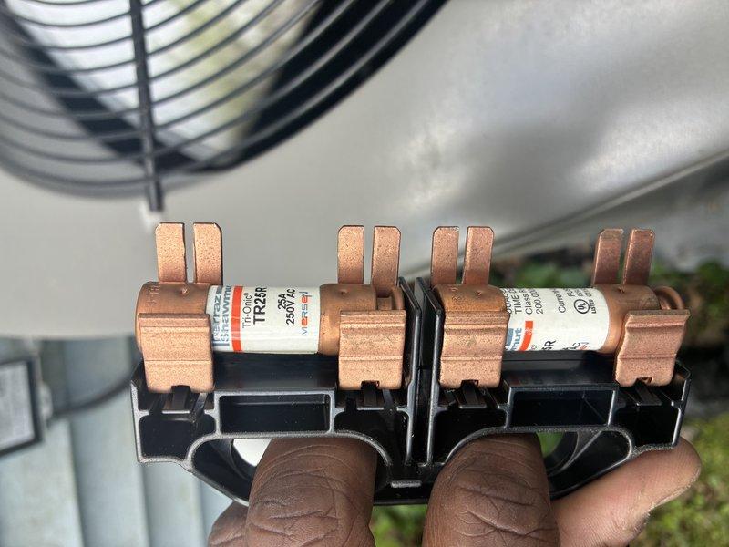 Completed MVP cooling maintenance visit on 3-year-old system. Inspected and tested electrical components including fuse block with four copper fuses, verified proper ratings and connections. Performed electrical diagnostics using clamp meter to measure voltage, amperage, and system performance at outdoor condensing unit. All electrical components tested within normal operating parameters and system operating efficiently.