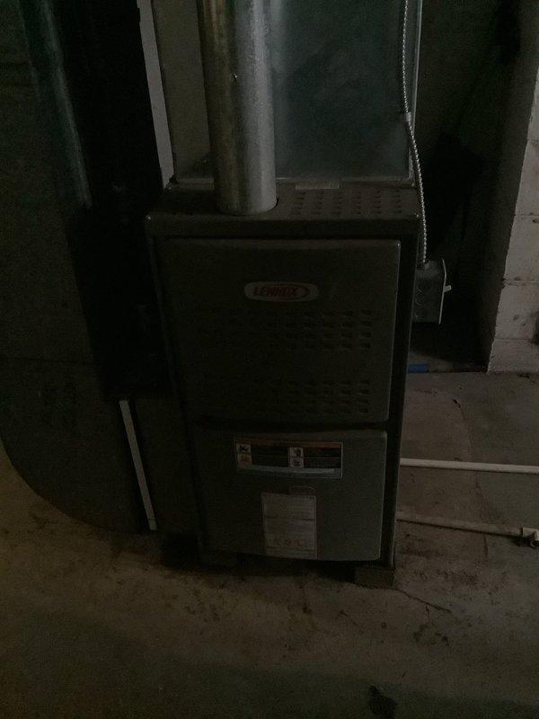 Completed scheduled maintenance inspection on 22-year-old Lennox furnace system located in basement utility area. Performed standard heating season preventive maintenance procedures including visual inspection of unit cabinet, ductwork connections, and venting systems. All components inspected and found to be operating within normal parameters, with unit showing typical age-related wear but no immediate service concerns identified.
