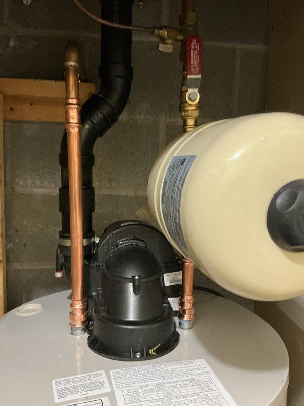 Replaced two 50-gallon power vent water heaters located on opposite sides of the residence with new Bradford White 50-gallon power vent units (model RBLW50S6N19) featuring 6-year manufacturer warranties. Installed new cold water shut-off valves, thermal expansion tanks, and updated drain pans for both units. Adapted all connections to existing vent pipes and completed full installation with proper plumbing connections and safety components.