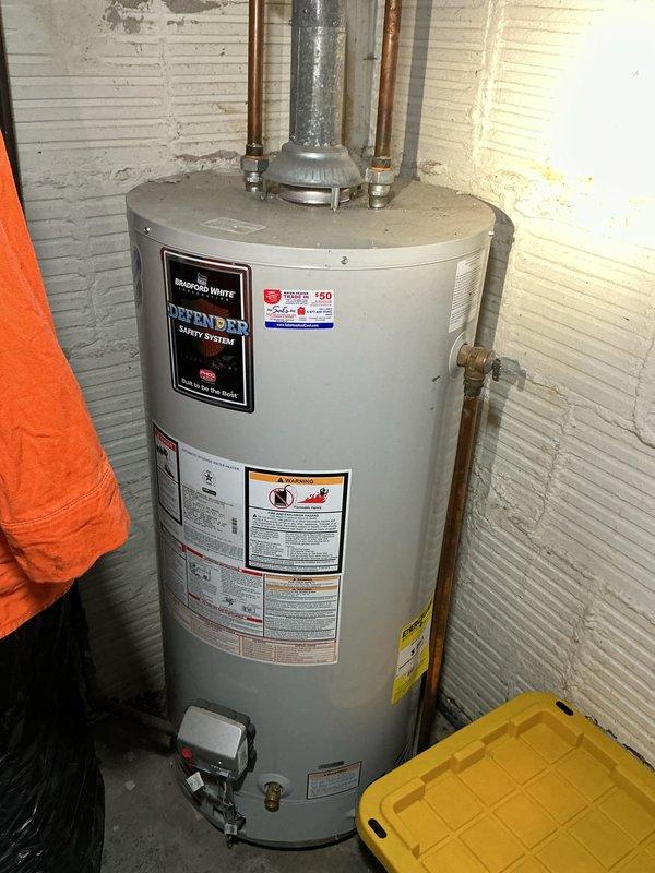 Responded to service call for toilet malfunction in 40-year-old residential property where customer suspected a urinal cap obstruction in the bowl trapway. Upon arrival, conducted thorough inspection of the affected toilet and documented existing plumbing infrastructure conditions. Assessed water heater installation and basement utility systems during diagnostic evaluation to determine if additional plumbing issues were contributing to the reported problem.