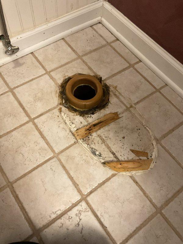 Responded to a basement bathroom experiencing toilet leakage at the base and sewage backup into the bathtub upon flushing. Removed the toilet to expose the flange and identified water damage on surrounding floor tiles. Performed a thorough snake augering of the branch line to clear the obstruction causing the backup. Reset the toilet with new wax ring and hardware, ensuring proper seal and secure mounting. Verified proper drainage and flush operation with no further leakage or backup issues.