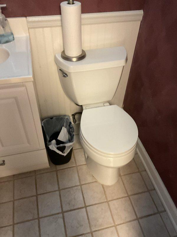 Responded to a basement bathroom experiencing toilet leakage at the base and sewage backup into the bathtub upon flushing. Removed the toilet to expose the flange and identified water damage on surrounding floor tiles. Performed a thorough snake augering of the branch line to clear the obstruction causing the backup. Reset the toilet with new wax ring and hardware, ensuring proper seal and secure mounting. Verified proper drainage and flush operation with no further leakage or backup issues.