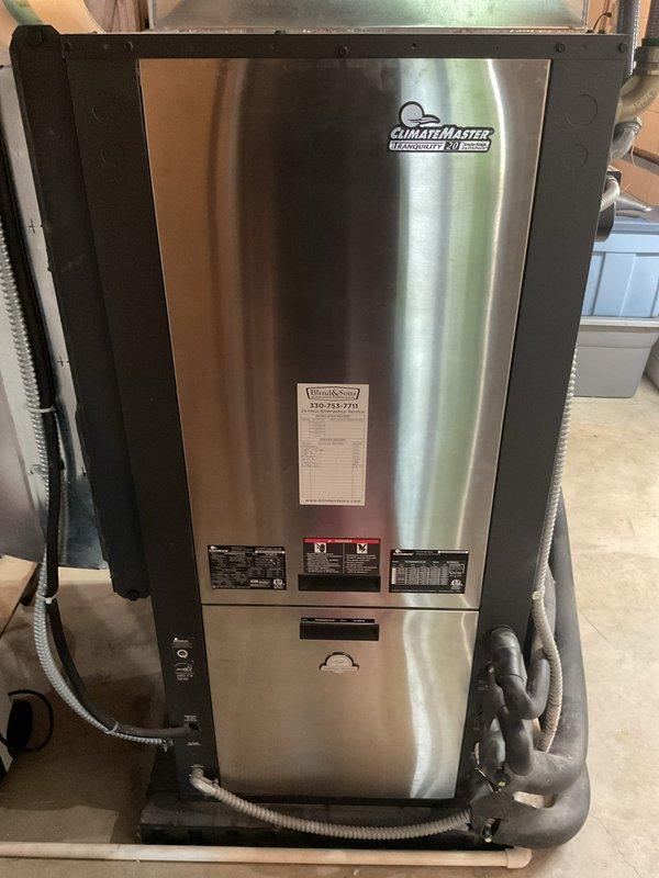 Completed preventative maintenance tune-up on an 8-year-old ClimateMaster Tranquility geothermal heat pump system. Inspected interior heat exchanger coil, noting dust and dirt accumulation on fins; cleaned coil surfaces and verified proper airflow. Examined electrical connections, wiring harness, and control circuitry within the unit compartment, confirming all components secure and operational. Checked refrigerant lines, condensate drain, and all mechanical components for proper function. Unit operating within normal parameters upon completion of service.