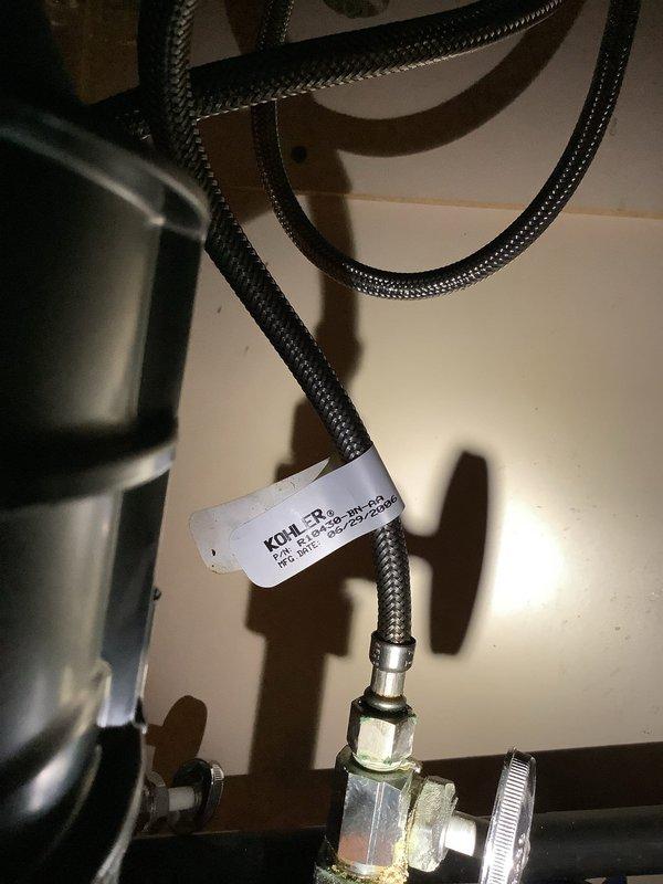 Responded to service call for leaking faucet on double-basin kitchen sink. Upon inspection, identified leak originating from supply line connections beneath the Kohler fixture. Tightened braided flexible supply hoses at connection points and verified proper sealing of fittings. Tested faucet operation across both basins, confirmed leak was resolved, and left fixture in proper working condition.