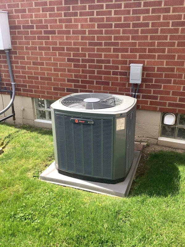 Performed preventive maintenance on 13-year-old Trane air conditioning system and furnace unit. Completed standard tune-up procedures including inspection of outdoor condenser unit, verification of electrical connections at disconnect box, and assessment of indoor furnace cabinet and flue pipe connections. All components found operating within normal parameters with no immediate service needs identified.