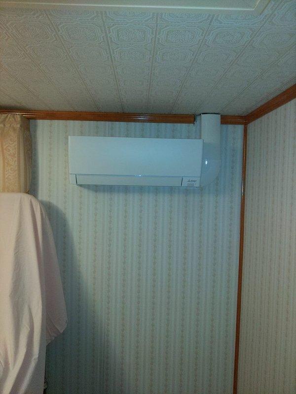 Completed installation of a 3-head ductless mini-split system in residential property. Mounted three indoor air handler units on interior walls in separate rooms, routing refrigerant line sets and electrical connections through attic space to outdoor condensing unit. All units tested and operational upon completion.