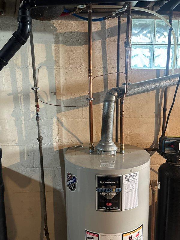 Completed installation of 20kW whole home standby generator with 100-amp automatic transfer switch. Ran 30 feet of electrical conduit and wiring from main service panel to generator location, and installed 20 feet of gas line from existing supply to unit. Transfer switch was wired and configured to provide seamless power transition during outage conditions. All electrical connections were made per NEC code requirements and manufacturer specifications. Generator was positioned on pre-existing concrete pad, leveled, and secured. Gas line pressure tested and verified for proper operation. System startup performed successfully with transfer switch cycling tested under load. Unit programmed for weekly exercise cycle and all safety interlocks verified operational.