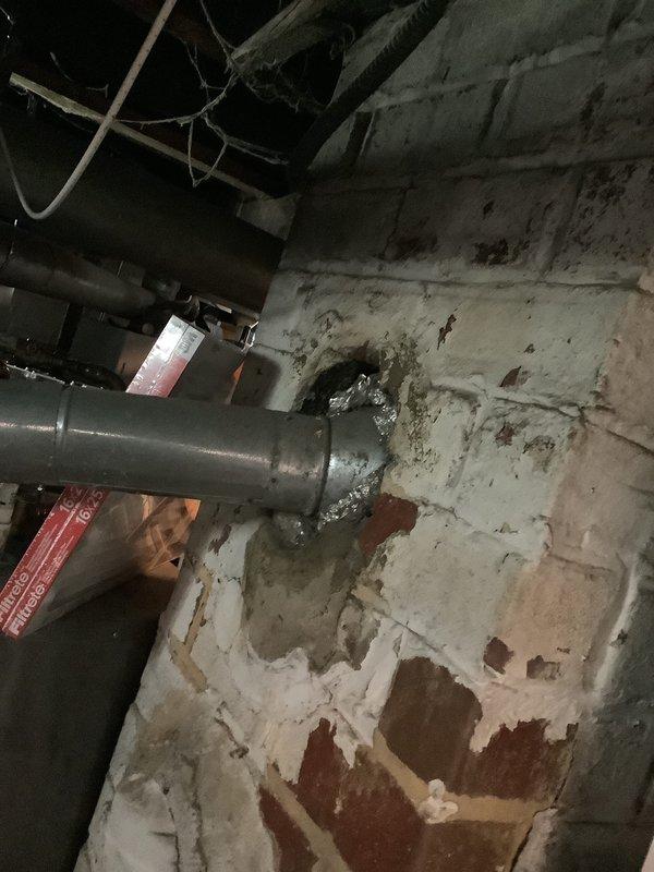 Conducted comprehensive on-site evaluation for complete furnace and air conditioning system replacement. Assessed existing gray furnace unit and associated ductwork in basement mechanical room, documenting current equipment specifications and configuration. Evaluated extensive moisture damage to foundation walls and deteriorating concrete surfaces that may impact equipment longevity and performance. Photographed existing HVAC installation including metallic supply ductwork, auxiliary air handling components, and copper refrigerant lines to determine proper sizing and configuration requirements for replacement system. Provided detailed equipment replacement estimate addressing current system deficiencies and environmental concerns in below-grade installation area.