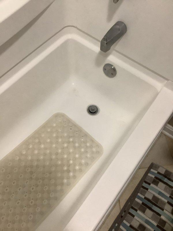 Responded to service call for slow-draining shower. Upon arrival, inspected bathtub drain and confirmed reduced water flow due to buildup and debris accumulation in the drain assembly. Cleared obstruction from drain strainer and tested water flow to verify proper drainage was restored.