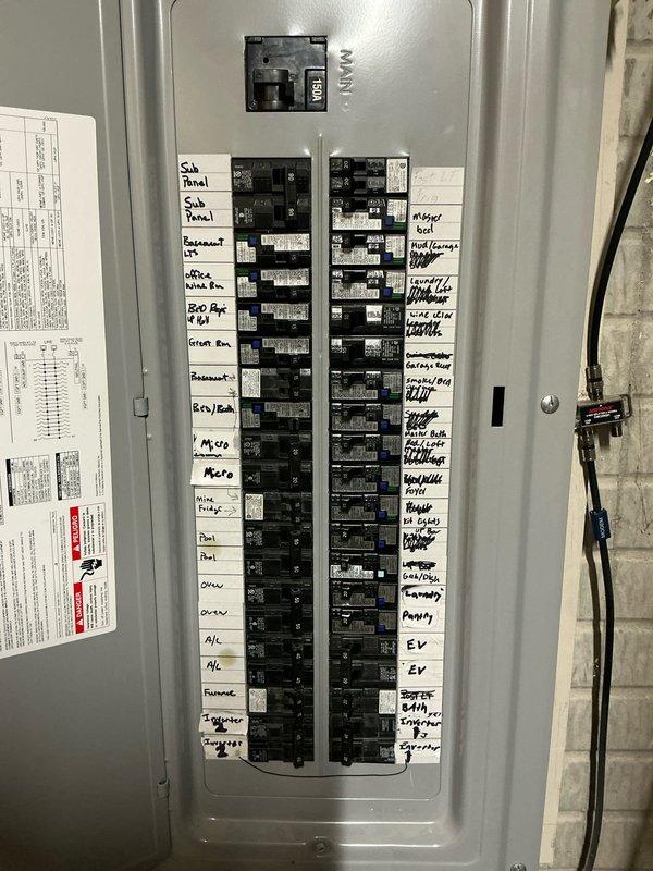 Conducted on-site evaluation for generator installation at residential property. Documented existing electrical infrastructure including main distribution panel with labeled circuit directory serving various residential loads including sub-panel, HVAC systems, pool equipment, and major appliances. Assessed exterior electrical service location and available space near HVAC condenser unit for potential generator placement and connection point to existing electrical system.