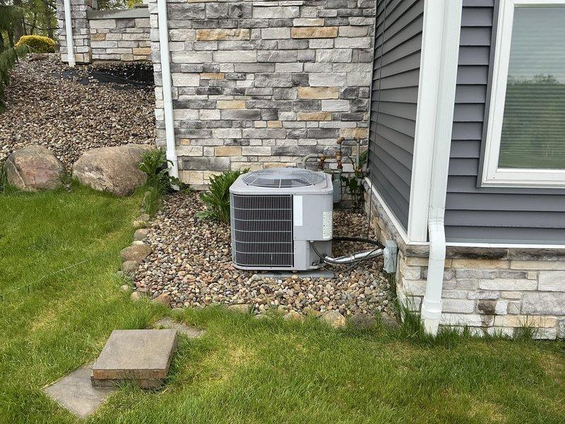 Conducted on-site evaluation for generator installation at residential property. Documented existing electrical infrastructure including main distribution panel with labeled circuit directory serving various residential loads including sub-panel, HVAC systems, pool equipment, and major appliances. Assessed exterior electrical service location and available space near HVAC condenser unit for potential generator placement and connection point to existing electrical system.