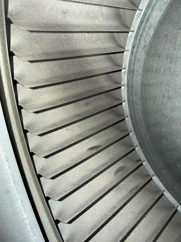 Completed scheduled cooling maintenance visit on HVAC system. Inspected air filter showing moderate dust accumulation with visible discoloration across mesh surface, and examined blower wheel assembly which displayed significant dust and debris buildup on metal blades and housing. System components photographed and documented for maintenance records.
