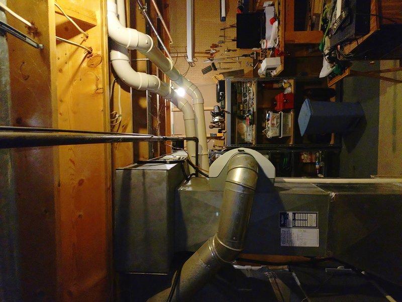Installed dedicated 240V circuit and outlet for electric vehicle fast charger in basement utility area. Ran new electrical conduit from main distribution panel to charging location, installed appropriate circuit breaker, and completed all connections per NEC requirements for EV charging equipment.