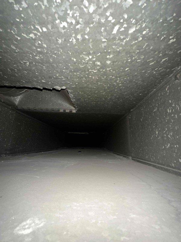 Completed comprehensive duct cleaning service for residential HVAC system covering up to 14 vents. Pre-service inspection revealed significant accumulation of dust, debris, and particulate matter throughout the ductwork, particularly concentrated along ceiling surfaces and wall transitions. Utilized professional duct cleaning equipment to remove built-up contaminants from all accessible ductwork sections, improving air quality and system efficiency.