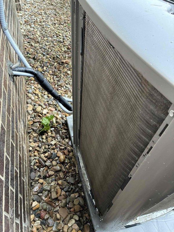 Completed scheduled MVP cooling maintenance visit on outdoor condensing unit. Upon arrival, observed significant dirt and debris accumulation on mesh filter screens affecting airflow efficiency. Performed comprehensive system inspection, cleaned condenser coils and protective screens, verified proper operation of all mechanical components, and ensured adequate clearance around unit. System restored to optimal operating condition with improved airflow through cleaned filters.