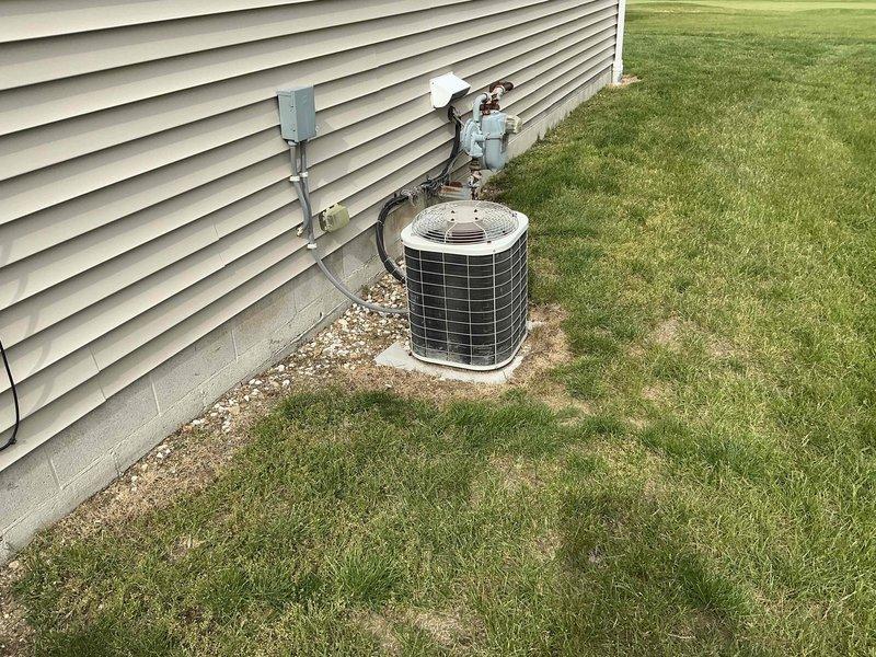 Completed comprehensive HVAC system replacement including installation of new Bryant furnace in interior mechanical room and matching outdoor condensing unit. The indoor unit was properly positioned with connected ductwork and venting, while the exterior condenser was mounted on gravel pad with appropriate clearances, refrigerant line connections, electrical conduit, and drainage considerations per manufacturer specifications.