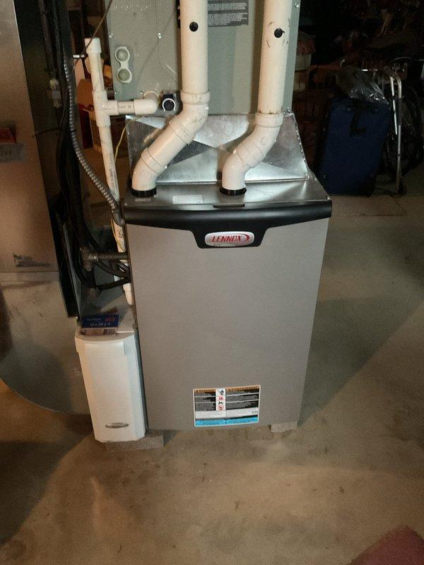 Completed MVP recurring cooling maintenance visit on residential Lennox HVAC system. Performed comprehensive inspection of furnace unit, blower motor assembly, electrical connections, and PVC venting system. All components found operating within normal parameters, with internal wiring and mechanical elements showing proper function. Documented equipment condition through photographic records for service history maintenance.
