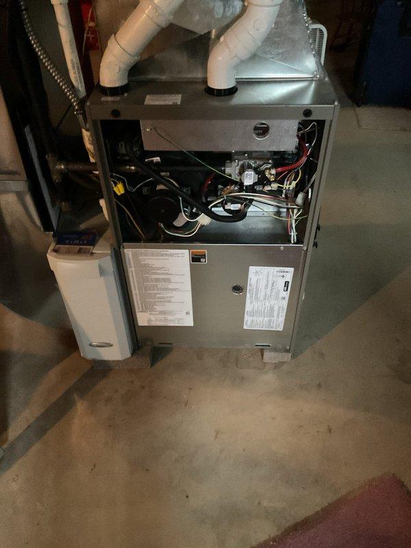 Completed MVP recurring cooling maintenance visit on residential Lennox HVAC system. Performed comprehensive inspection of furnace unit, blower motor assembly, electrical connections, and PVC venting system. All components found operating within normal parameters, with internal wiring and mechanical elements showing proper function. Documented equipment condition through photographic records for service history maintenance.