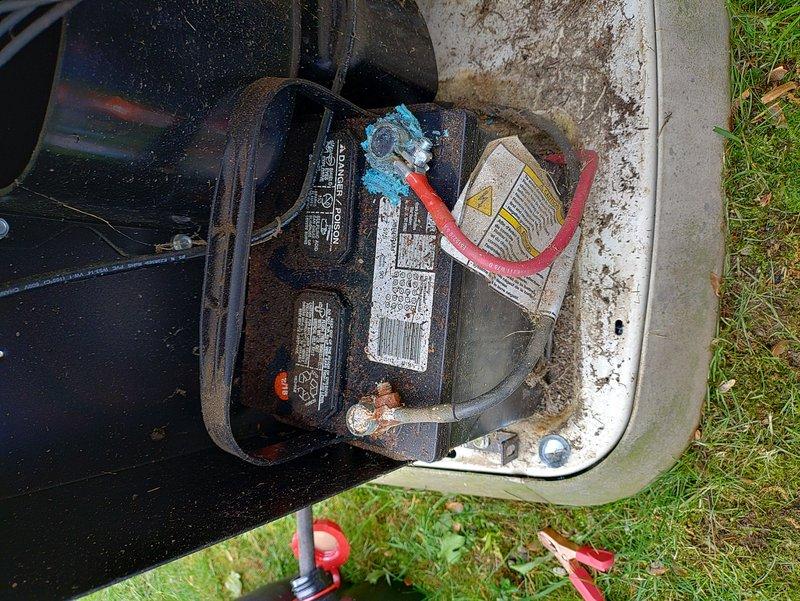 # Generator Preventive Maintenance

Performed scheduled preventive maintenance on Generac standby generator unit. Conducted thorough inspection of battery compartment, revealing significant corrosion on battery terminals and connections. Cleaned battery terminals, removed oxidation buildup, and treated corroded connections with protective compound. Tested battery voltage and charging system functionality. Verified proper cable connections and secured all electrical terminations. Documented equipment condition with photographic evidence showing pre-service corrosion levels and compartment weathering for maintenance records.