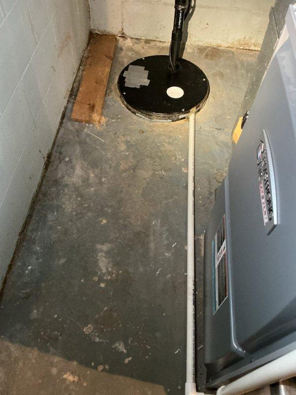 Responded to service call for leaking tanked water heater in residential basement. Upon arrival, performed comprehensive assessment of existing water heater system and surrounding plumbing connections. Inspected copper supply lines, brass shutoff valves, temperature and pressure relief valve, and all associated piping for signs of deterioration and active leaks. Documented current installation configuration including hot and cold water distribution lines, galvanized steel cross-connections, and proper venting arrangements. Examined floor area surrounding unit and confirmed active water leakage from tank, indicating internal tank failure. Photographed existing plumbing setup showing multiple copper pipe connections, brass ball valves with handles, metallic elbow joints, and mounting hardware attached to ceiling joists. Prepared detailed estimate for complete water heater replacement including removal of failed unit, installation of new tanked water heater with proper code-compliant conn