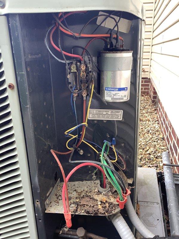Completed MVP heating and cooling maintenance visit on 15-year-old system. Performed comprehensive inspection of outdoor unit, examining electrical components including capacitor, contactor, and wiring connections. All components found to be in proper working condition with secure mounting and connections. Documented equipment condition with photographs for service records.