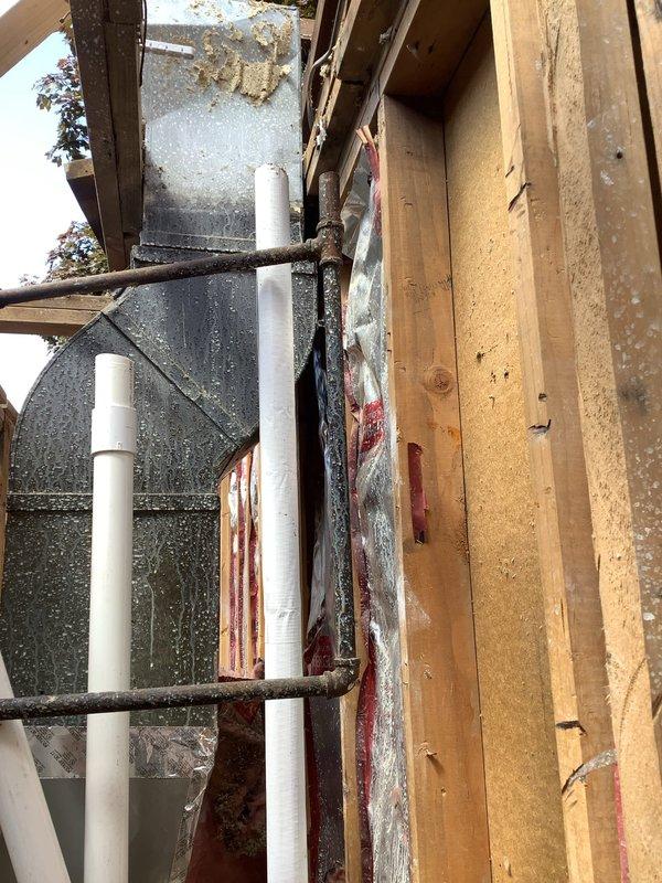 Responded to emergency call for damaged water/gas line requiring immediate repair. Upon arrival, assessed the affected area where utility lines had been severed during construction activities. Safely capped and repaired the compromised water line using appropriate fittings and PVC connections to restore system integrity. Inspected surrounding plumbing infrastructure within the exposed framing to ensure no additional damage occurred. Verified all connections were secure and tested the repaired line for proper flow and leak-free operation before completing the service.