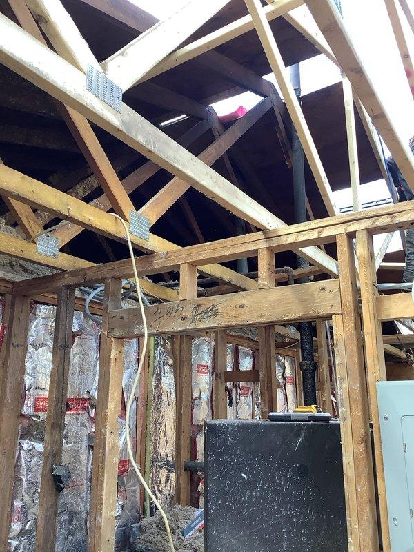 Responded to emergency call for damaged water/gas line requiring immediate repair. Upon arrival, assessed the affected area where utility lines had been severed during construction activities. Safely capped and repaired the compromised water line using appropriate fittings and PVC connections to restore system integrity. Inspected surrounding plumbing infrastructure within the exposed framing to ensure no additional damage occurred. Verified all connections were secure and tested the repaired line for proper flow and leak-free operation before completing the service.