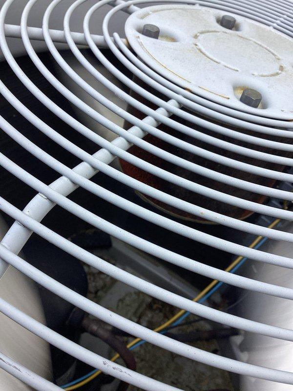 Completed comprehensive cooling system tune-up on 7-year-old residential air conditioning unit. Inspected outdoor condenser unit including fan grille assembly and verified proper operation; examined indoor blower wheel assembly for cleanliness and structural integrity. All components found operating within normal parameters with routine wear appropriate for unit age.