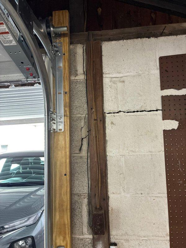 Provided comprehensive quote for installation of exterior electrical outlets and complete garage wiring replacement. Conducted thorough assessment of existing electrical infrastructure in garage and attic space, identifying aged wiring systems requiring replacement. Evaluated HVAC ductwork proximity and structural beam locations to determine optimal routing for new electrical circuits. Documented existing conditions including exposed wiring along wooden structural elements and current electrical panel configuration to develop scope of work for safe, code-compliant installation.