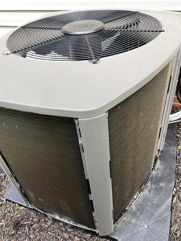 Completed recurring AC maintenance on residential cooling system. Performed comprehensive inspection of outdoor condenser unit, including cleaning of mesh screening panels, verification of fan operation through protective grille, and assessment of unit positioning on concrete pad. Inspected indoor mechanical components including condensate pump with operational indicator lights, PVC drain lines, flexible refrigerant lines, and associated plumbing connections in basement utility area. All components found operating within normal parameters with no immediate service needs identified.