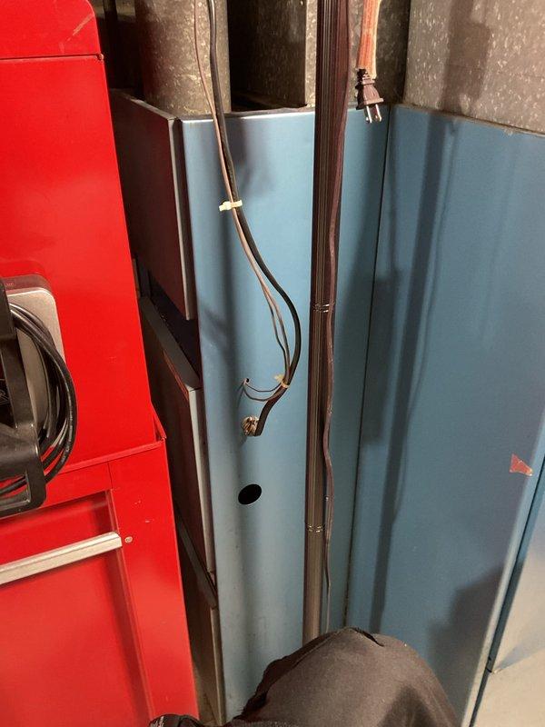 Completed comprehensive tune-up on 15+ year old air conditioning system. Inspected condenser fan assembly showing significant rust and corrosion on blades and central hub, documented condition for customer awareness. Verified air handler unit operation, checked refrigerant line connections and insulation integrity, and confirmed all mechanical components functioning within acceptable parameters despite age-related surface deterioration.