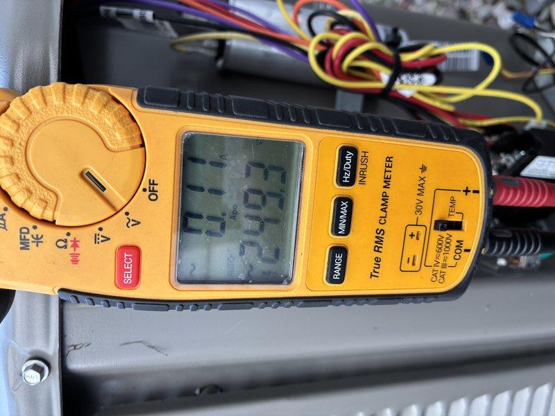 Completed annual MVP cooling maintenance visit on one-year-old system. Performed comprehensive electrical diagnostics using digital clamp meter to measure amperage draw and verify proper system operation. Inspected control board wiring connections, including power supply lines and low-voltage control circuits. All electrical connections found secure with proper wire routing through conduit. System operating within normal parameters with amperage readings at 33.73 amps, indicating appropriate compressor and condenser fan motor performance. No deficiencies noted during inspection.