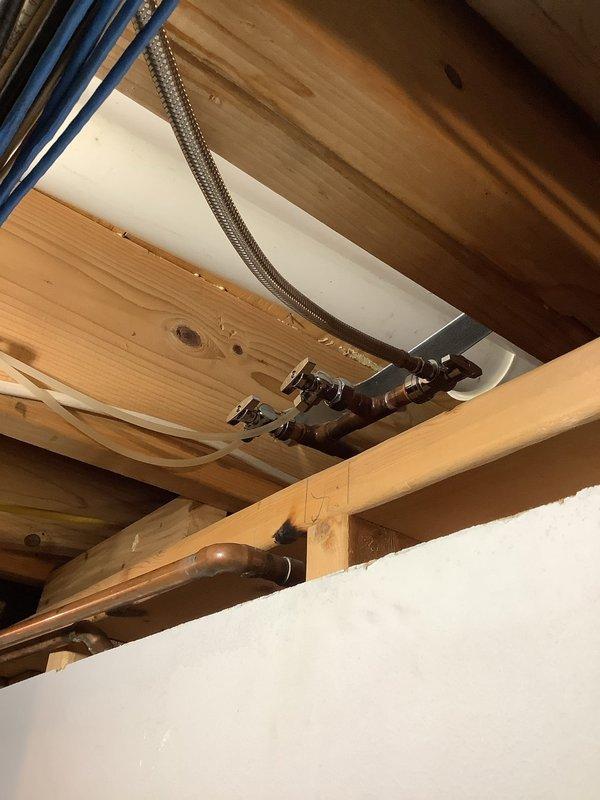 Replaced three 1/2" x 1/4" compression shut-off valves located in the basement near the furnace. Installed new feed line from one valve back to the refrigerator, ensuring proper water supply connection. Parts were ordered for shop delivery and received as scheduled. Work completed during morning appointment window with half payment collected at time of service scheduling.